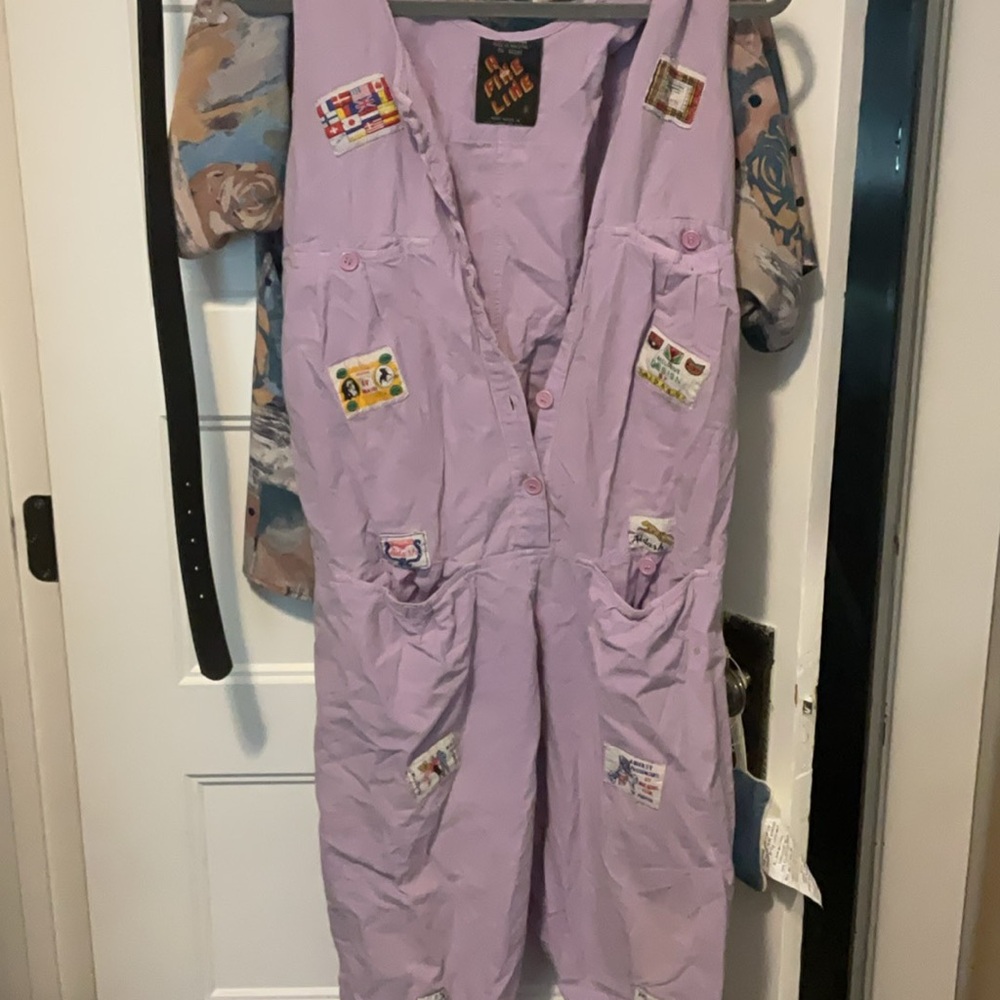 A fine line Purple Jumpsuit with Patch Details